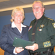 Capt. Penny Phelps, left, received a Distinguished Service Award for her work training county employees in customer relations.